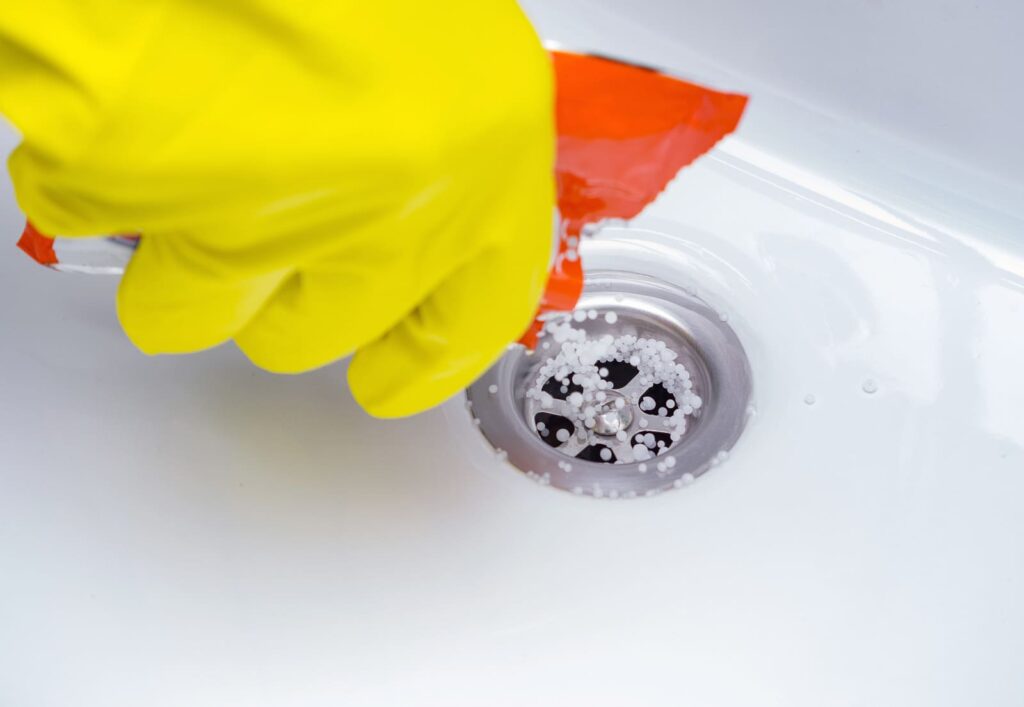 drain cleaner unclogging a drain